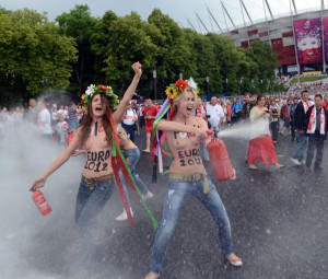 Members of Ukrainian feminist group Femen protests against prostitution near the National Stadium in Warsaw on June 8, 2012, before the opening match of the Euro 2012 football championship between Poland and Greece.  AFP PHOTO / JANEK SKARZYNSKI